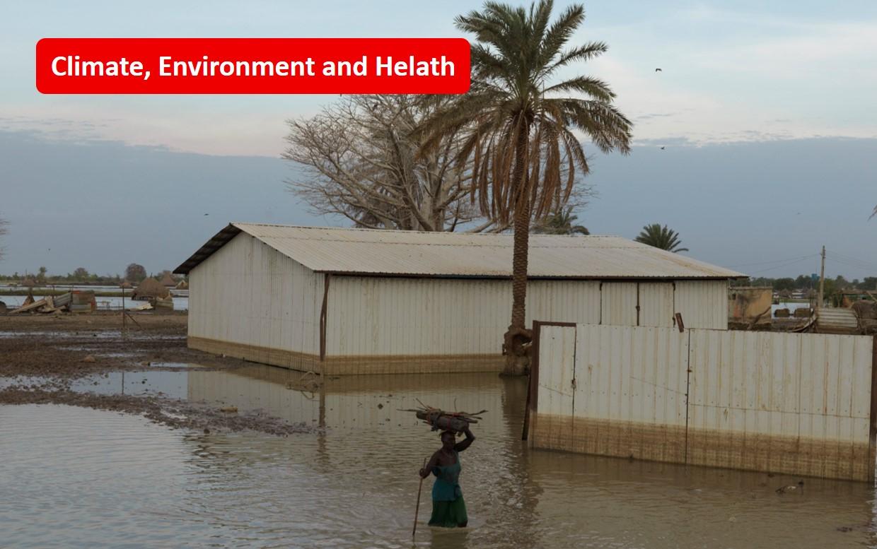 A woman walks through flood waters in Rubkona, South Sudan