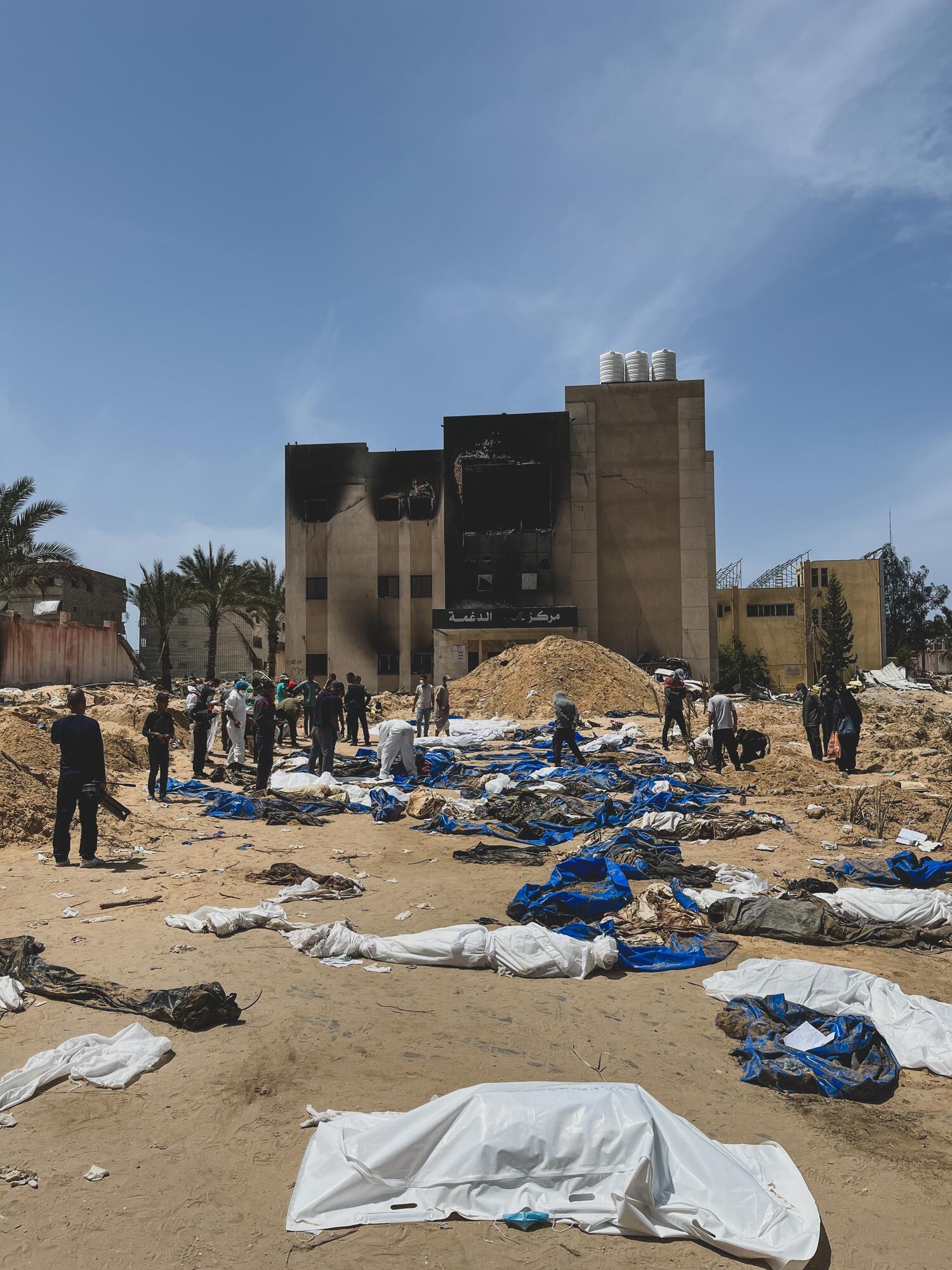 Identifying bodies uncovered from a mass grave at Nasser Hospital on April 22. Palestine 2024 © MSF