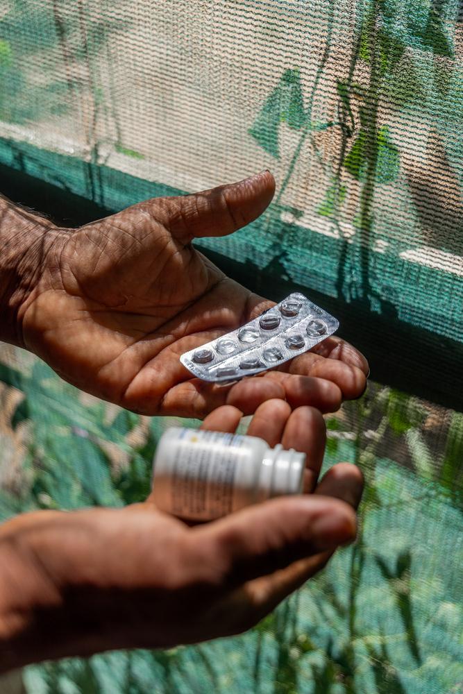 Amer, a 36-year-old Syrian refugee in Lebanon holds his empty hypertension medication. The country's economic crisis, coupled with recent security measures, have made accessing medication a nightmarish struggle for many non-communicable-disease patients. © Carmen Yahchouchi for MSF 