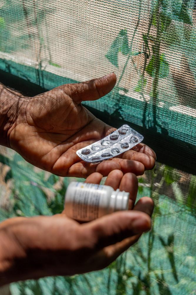 Amer, a 36-year-old Syrian refugee in Lebanon holds his empty hypertension medication. The country's economic crisis, coupled with recent security measures, have made accessing medication a nightmarish struggle for many non-communicable-disease patients. © Carmen Yahchouchi for MSF 