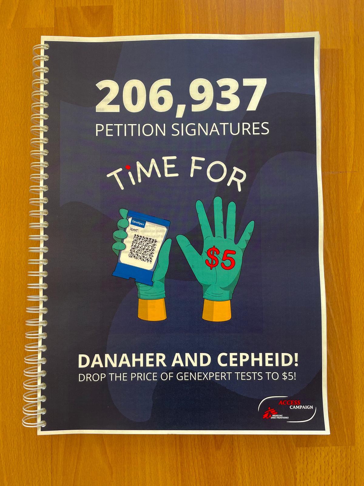 Following the “Time for $5” campaign, MSF delivers 206,937 signatures to Danaher demanding a $5 price for its medical tests.