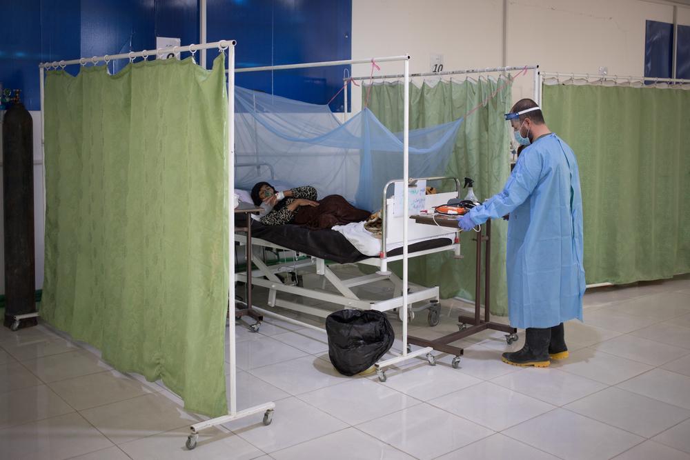 Abdul Harma, head nurse at the hospital specialising in COVID-19 in Hassakeh, in northeast Syria, provides care to a lady from a village not far from Hassakeh. 