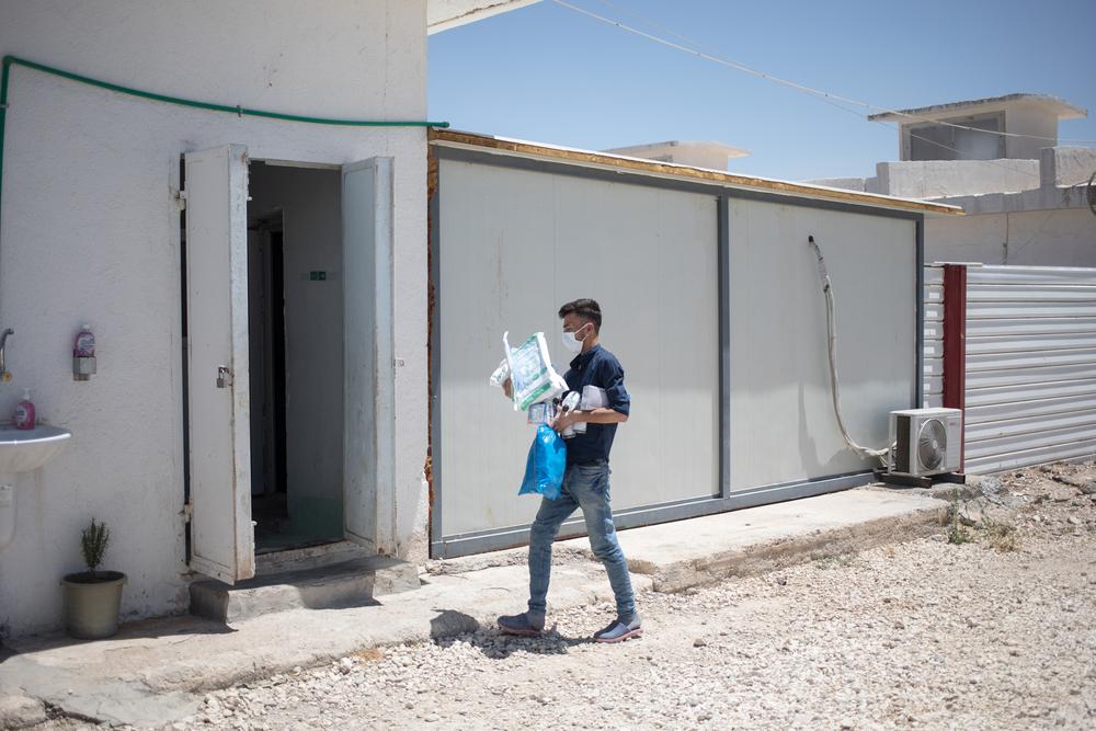 A nurse brings equipment to the hospital specialising in COVID-19 in Hassakeh, in northeast Syria. 