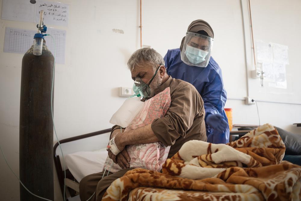 A patient receives care in the COVID-19 ward of Raqqa National Hospital, in northeast Syria. 