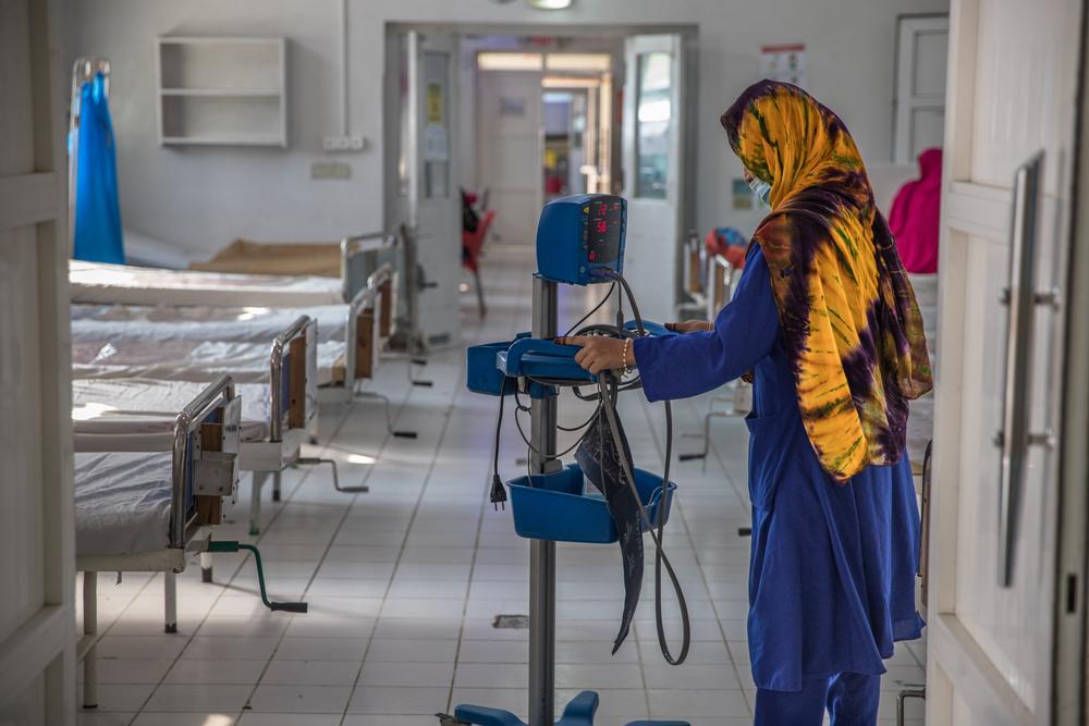 An MSF staff member inspects equipment in a ward for women to receive care following c-sections, Khost maternity hospital 