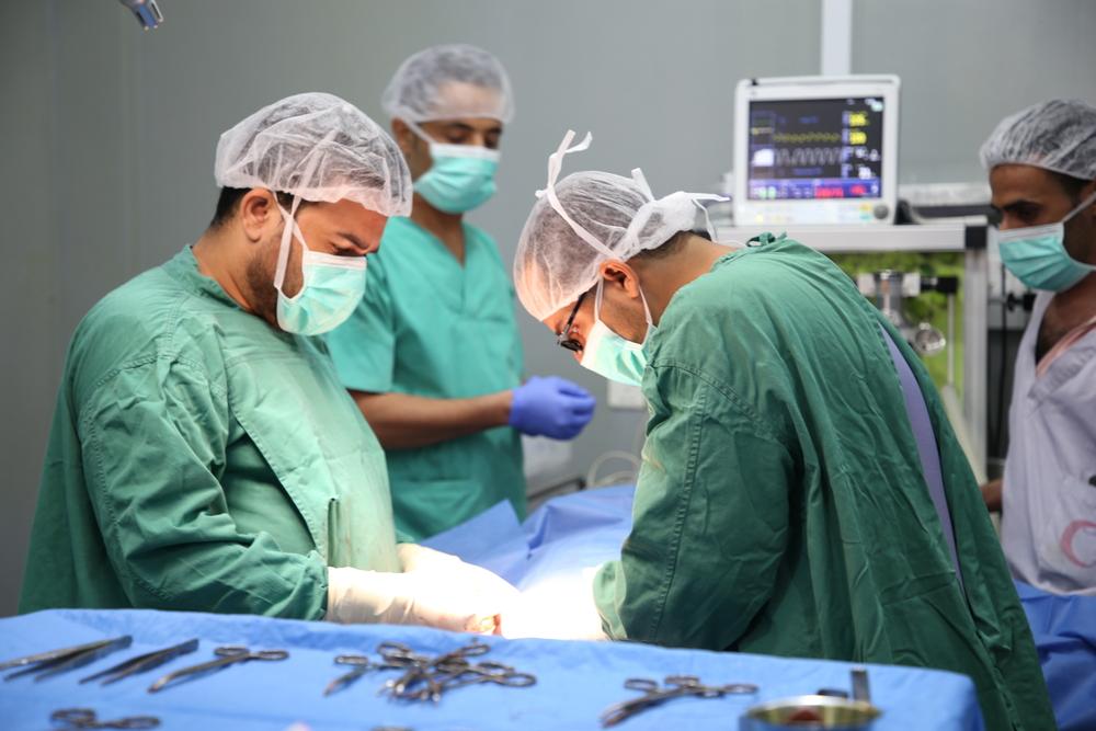 An MSF team performing emergency surgery in the operating room of Abs Hospital in Hajjah.