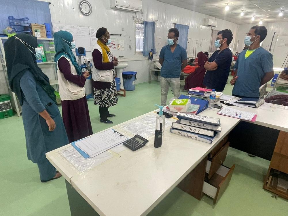 Rebecca Smith (third from left) discusses operations with her staff. 