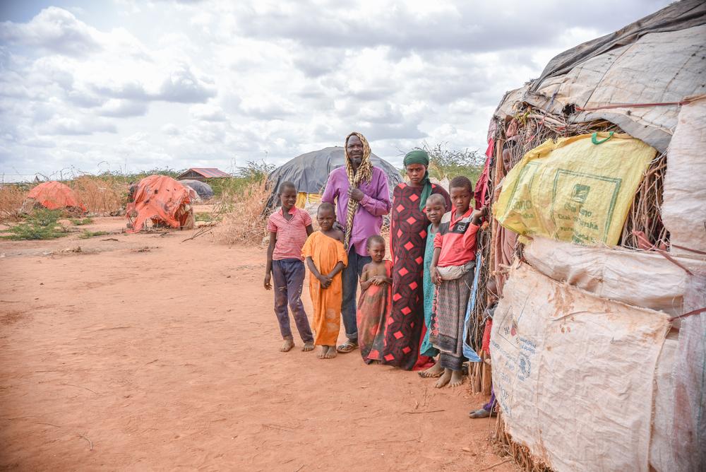 Borow Ali Khamis, 50, stands outside his makeshift shelter with his family in the Dagahaley refugee camp. 