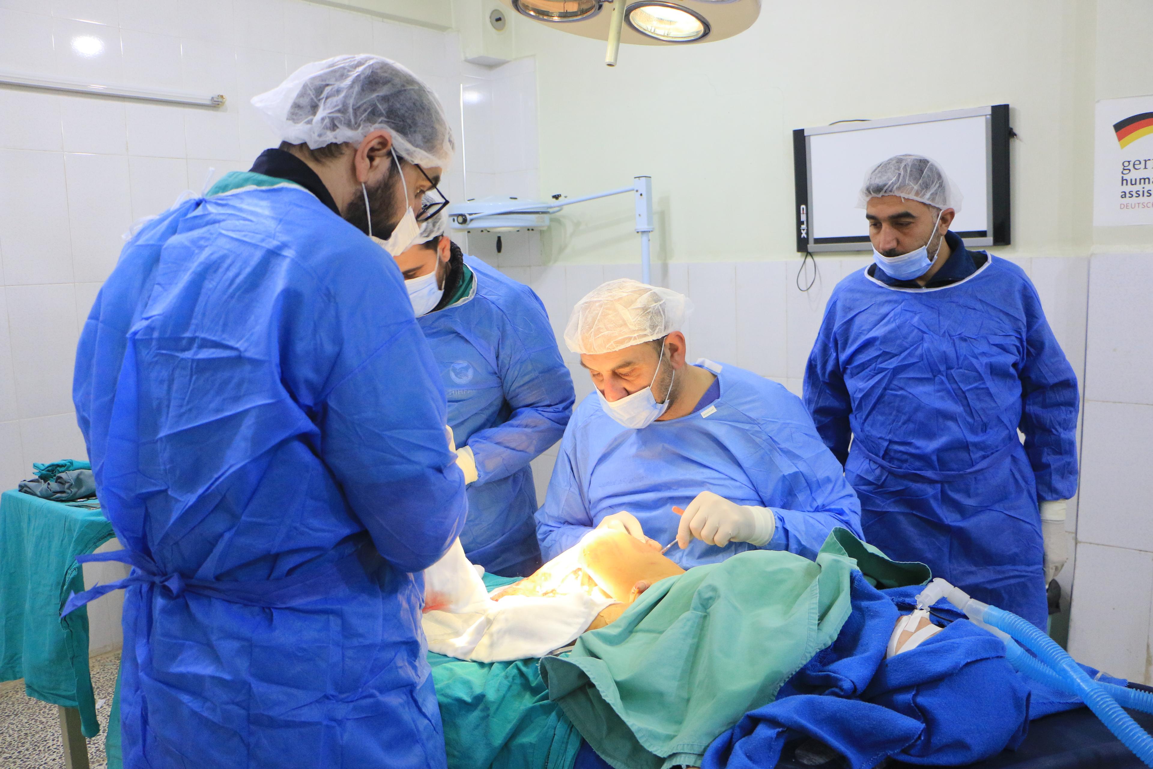 Syrian doctors operate on a patient in a hospital in Atmeh. The equipment for the operating theatre in this hospital was donated by the MSF team in Atmeh. 11 February 2023. 