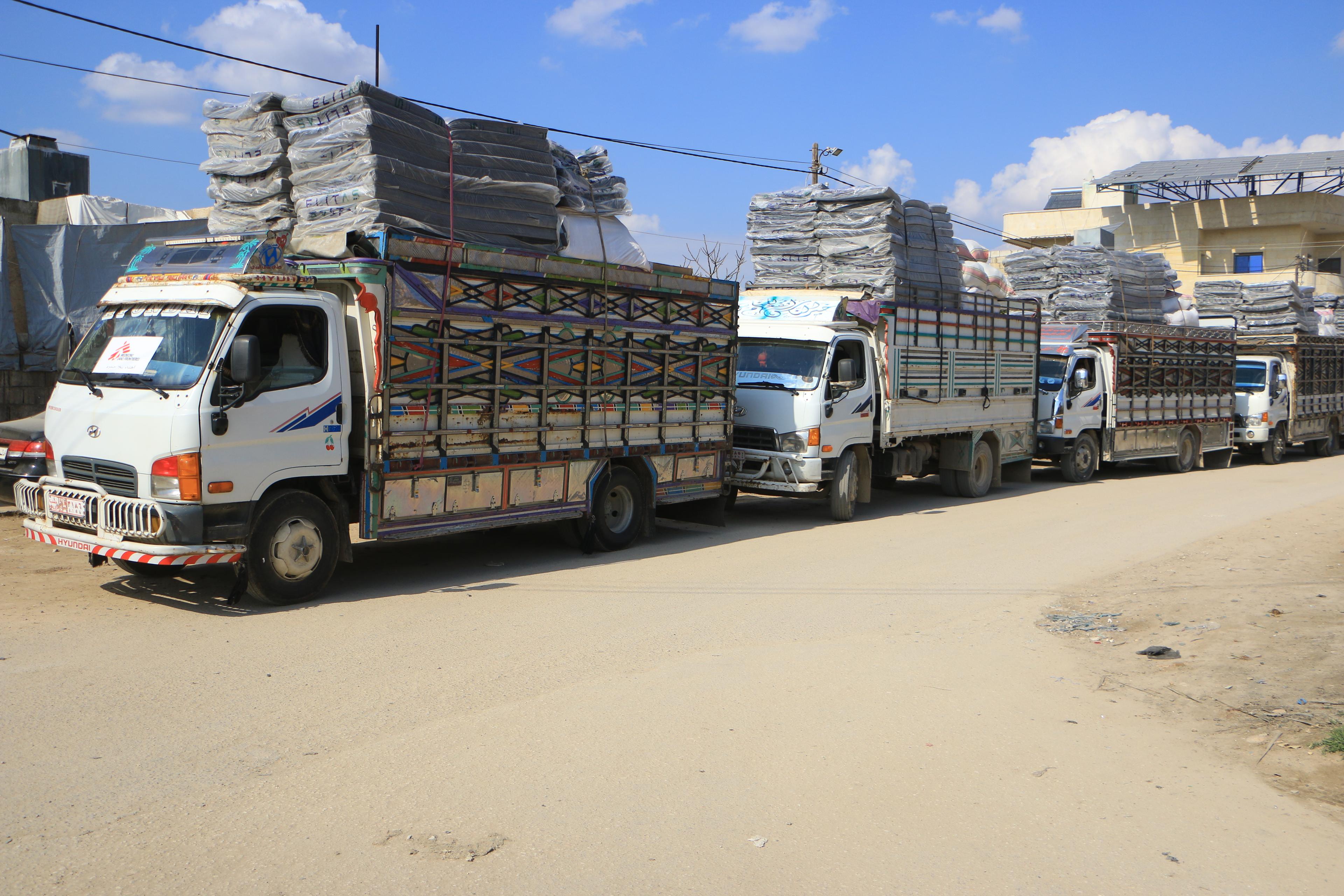Trucks chartered by MSF teams from Atmeh hospital on their way to distribution on 11 February 2023. 