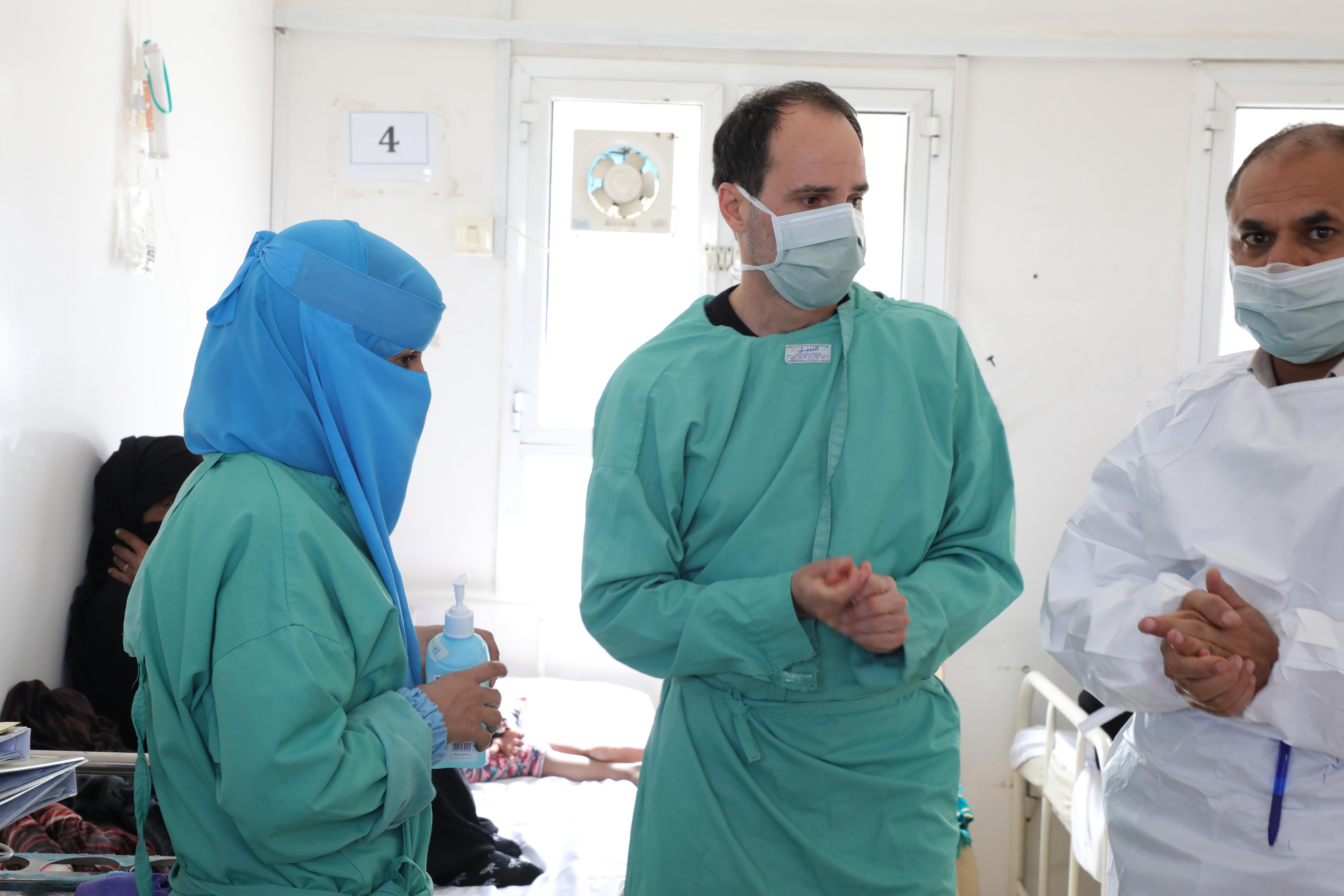 MSF International President Dr Christou examines patients at the measles isolation centre at Al Salam Hospital in Khamer, Amran State. 