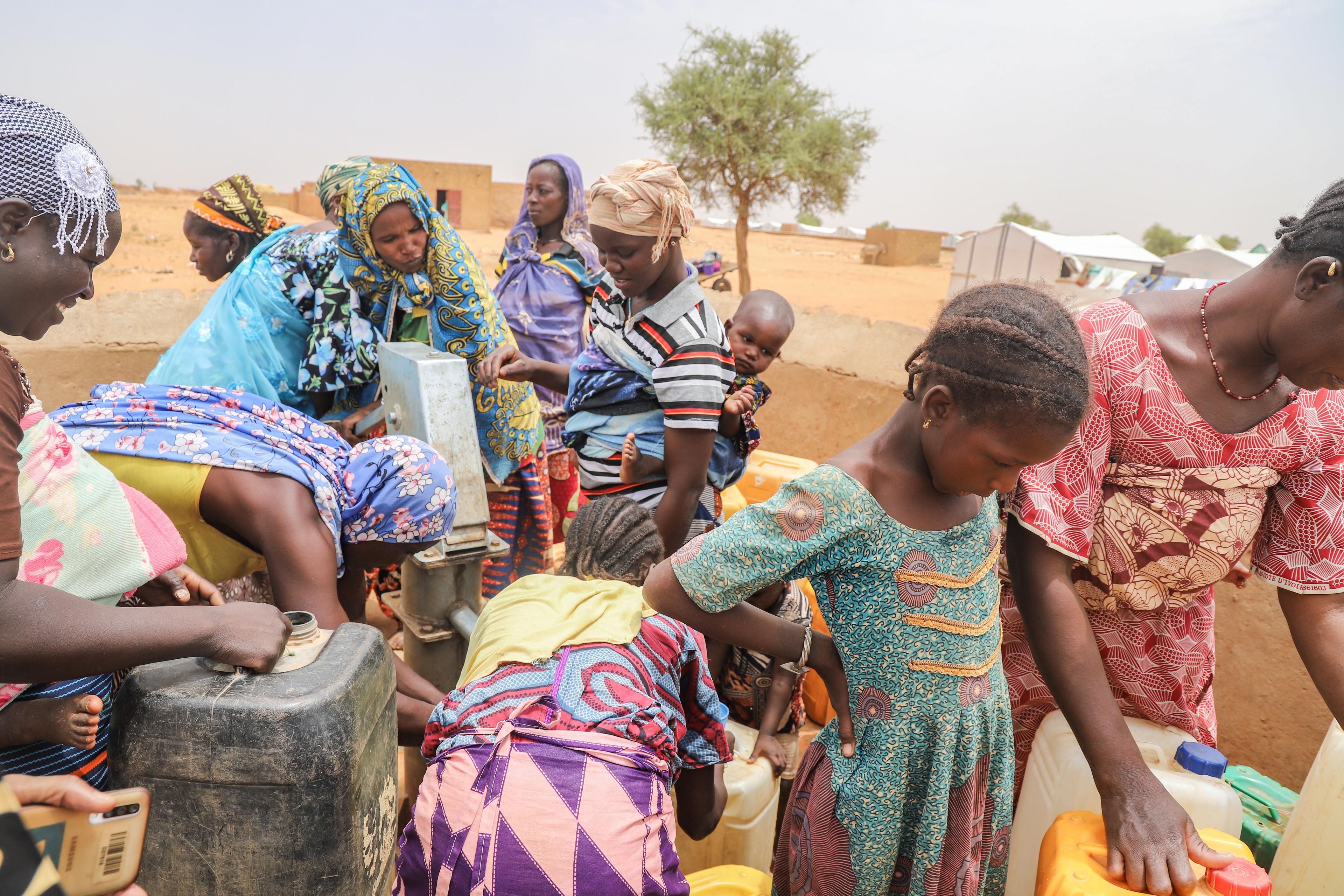 Women collect water at a water point rehabilitated by MSF in Djibo. 