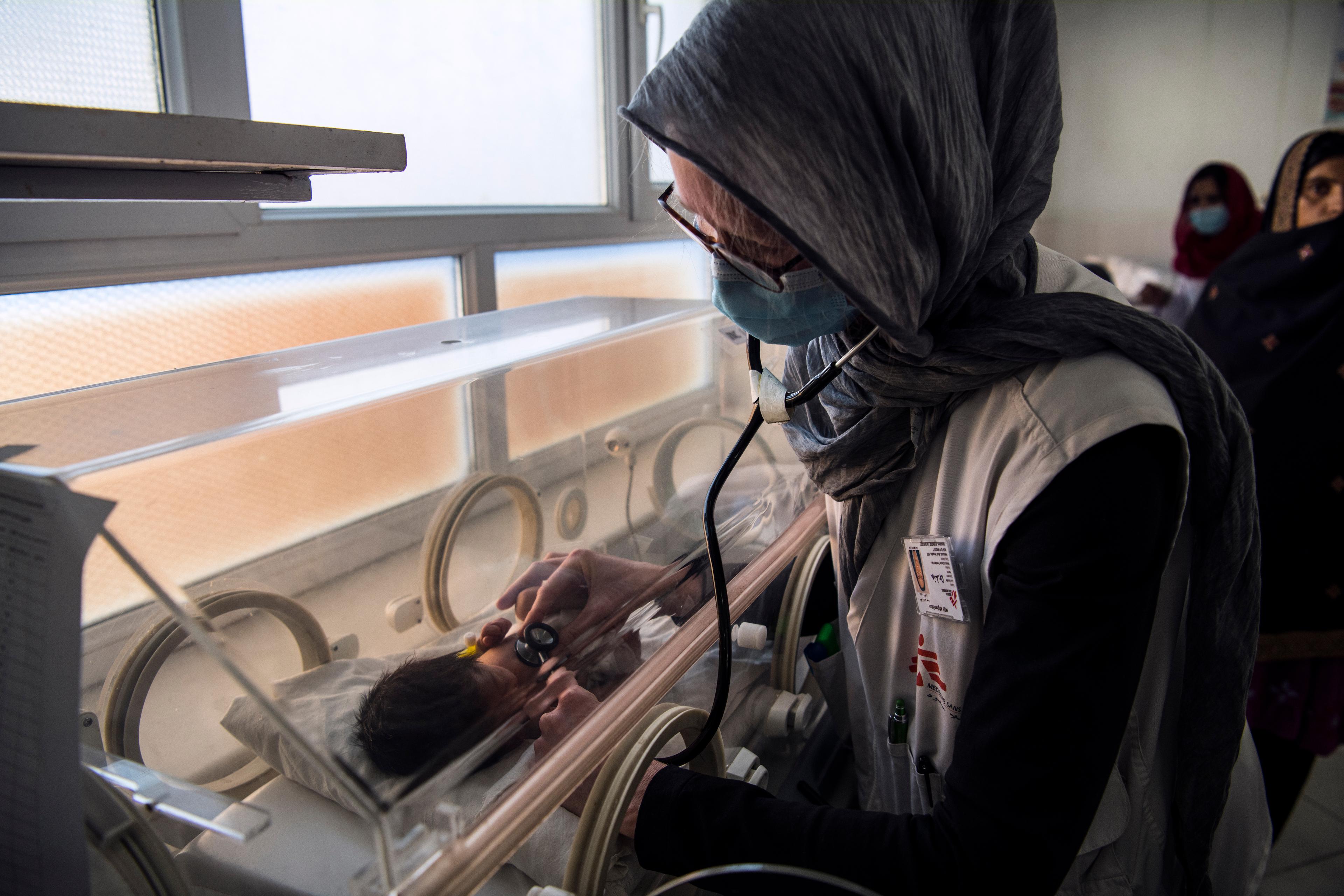 Dr Lia, a paediatrician, examines a baby in the neonatal intensive care unit of Boost Hospital, the main provincial hospital in Helmand, located in the capital Lashkar Gah. 