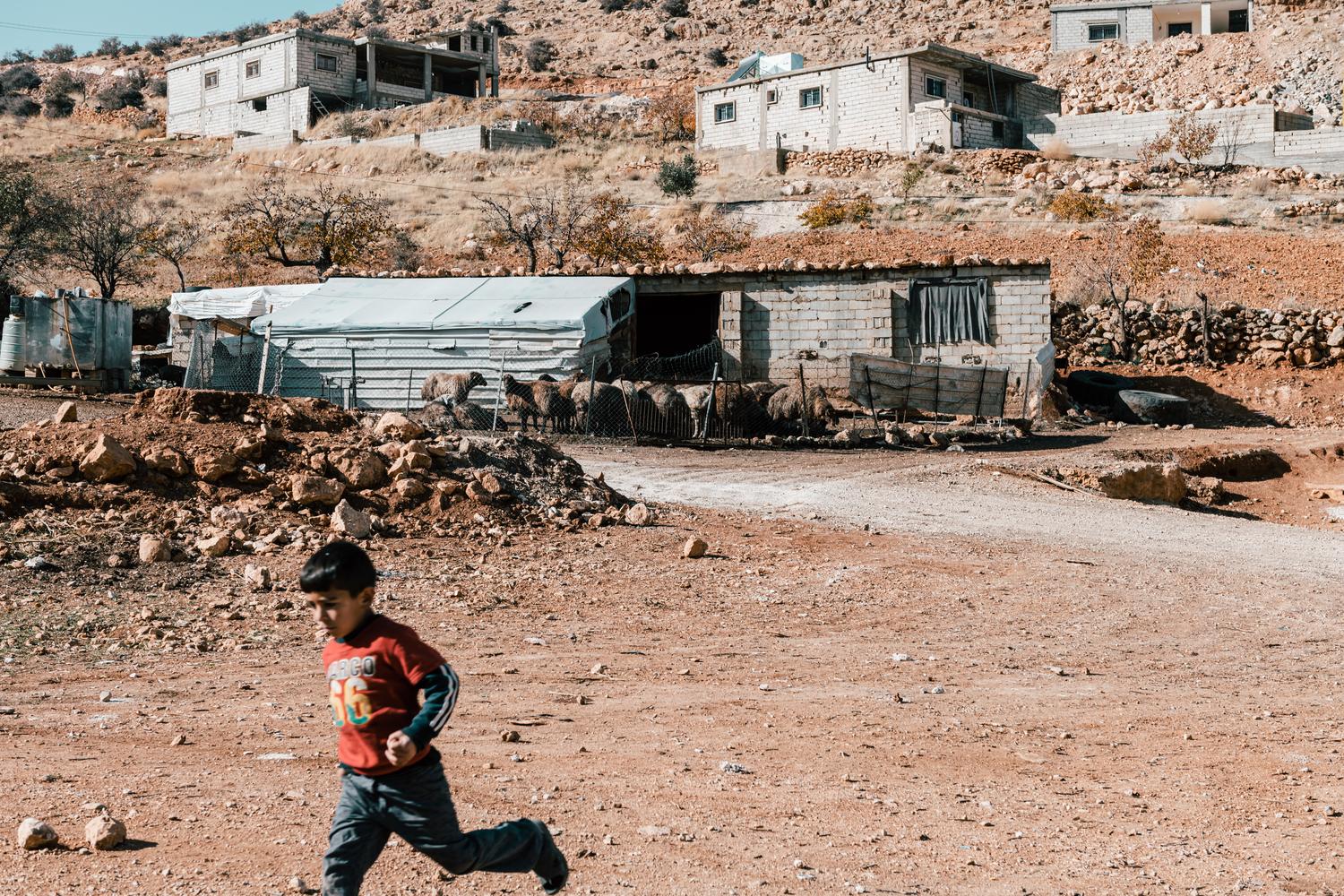 A child in Rif Al Sham informal tented settlement (ITS) in Arsal. Lebanon, December 2020. 
