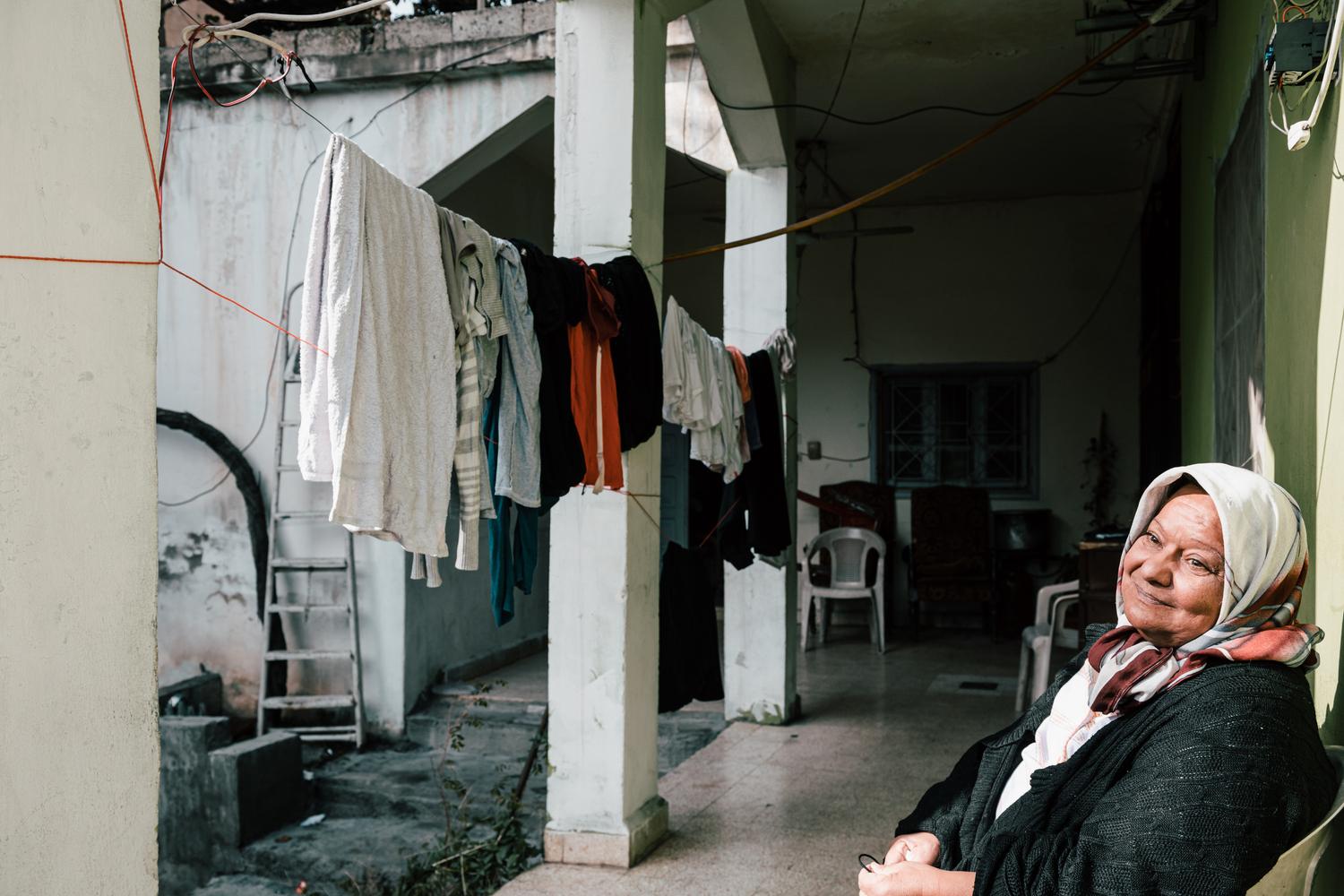 Fatima sits in front of her in-laws&#039; house, where she lives with her husband and only daughter, in Hermel, in the north of the Bekaa Valley. Lebanon, December 2020. 