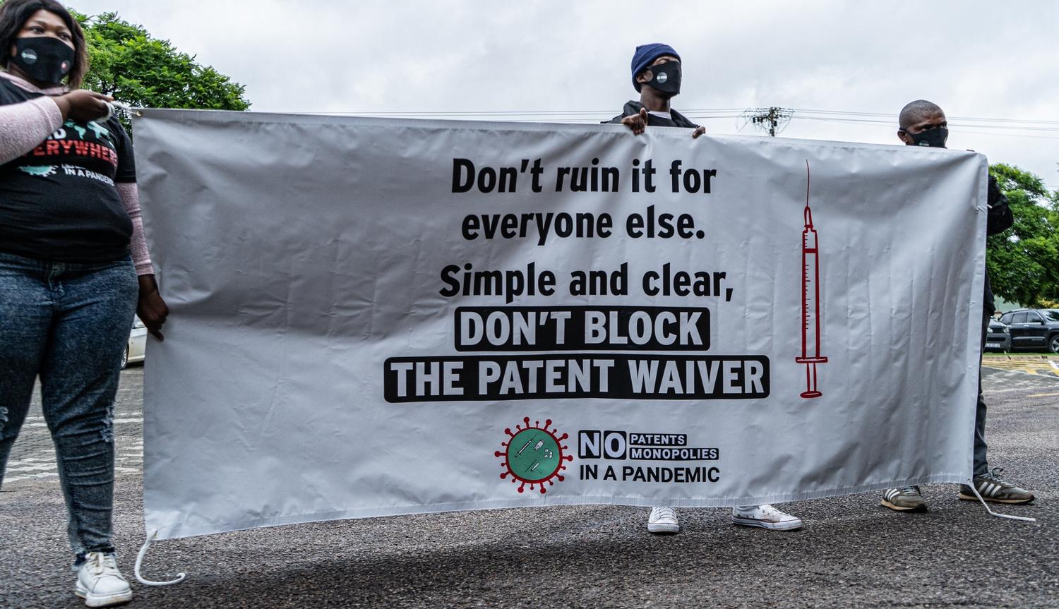 Protestors from various civil society organisations protest the opposal by rich countries of a waiver on patents on COVID-19 tools outside the Australian embassy. South Africa, February 2021. 