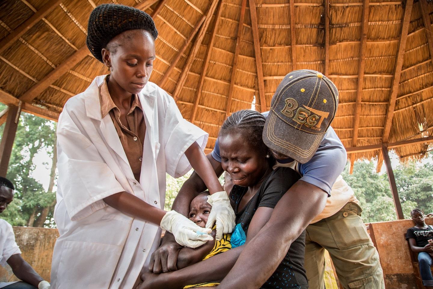 A child ireceaves a multi-antigen vaccination in Central African Republic against diphtheria and six other diseases. 