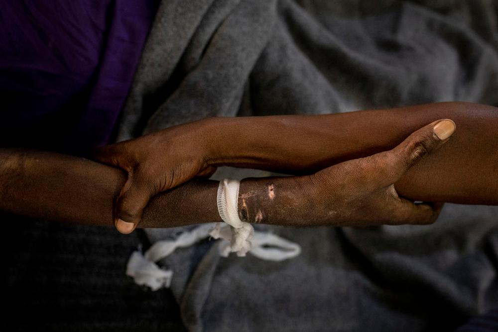 John * and Jean * hold each other at CHK in Kinshasa, Democratic Republic of Congo. John was diagnosed with HIV in 2010. 