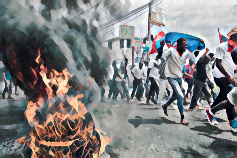 Haitian protesters run past burning tyres during a demonstration in Port-au-Prince, Haiti. 