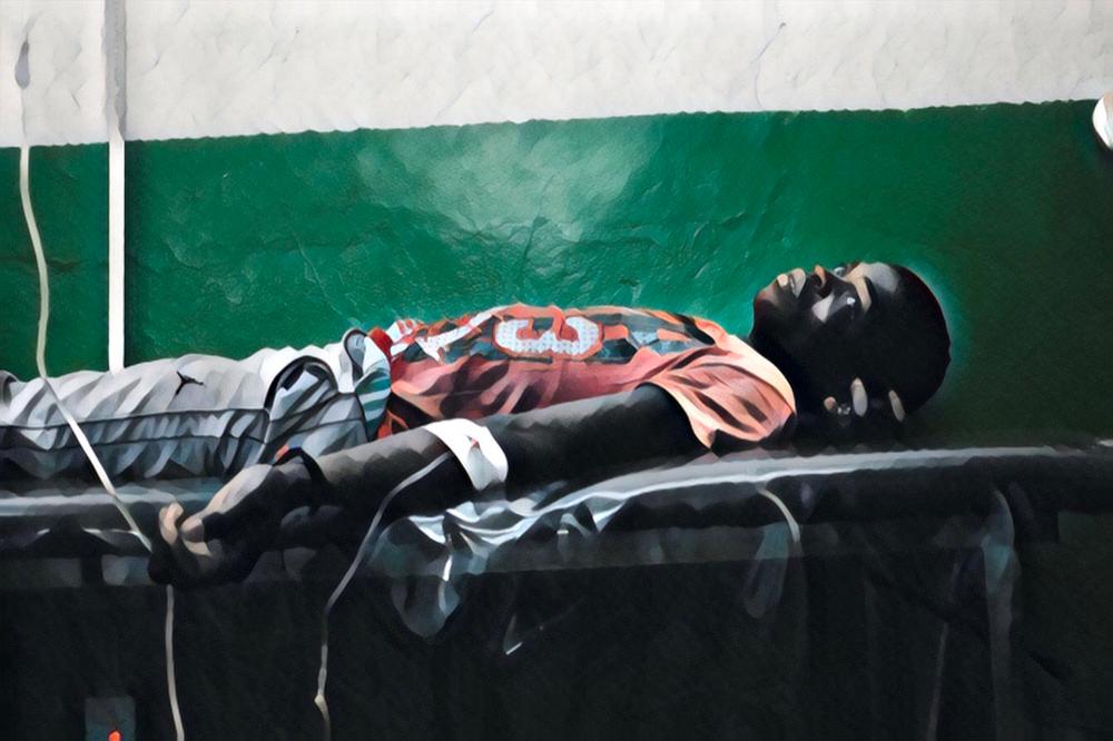 A young man with gunshot wounds in Martissant hospital, Haiti 